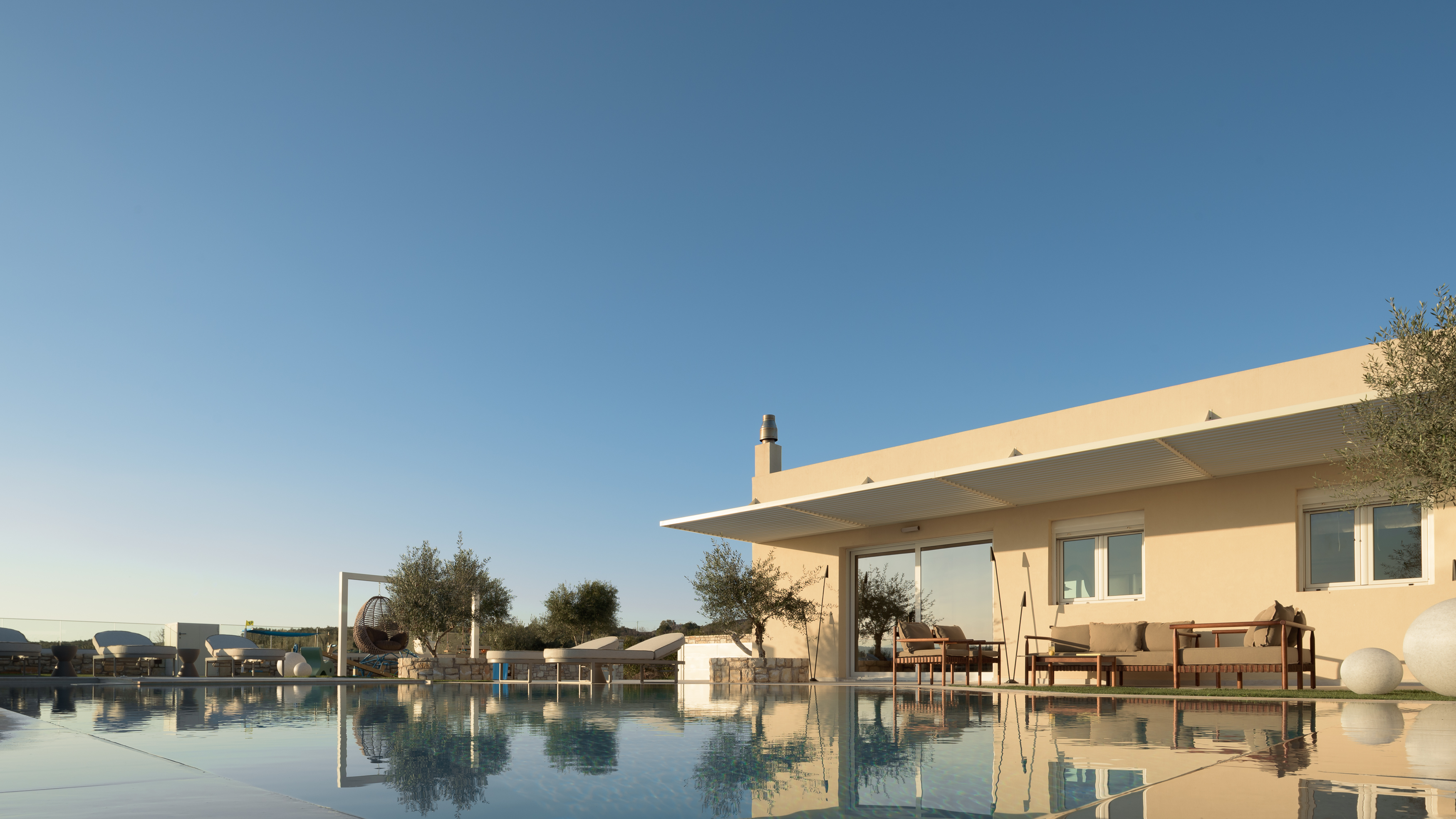 Nestled among whispering olive trees, a sanctuary of serenity.