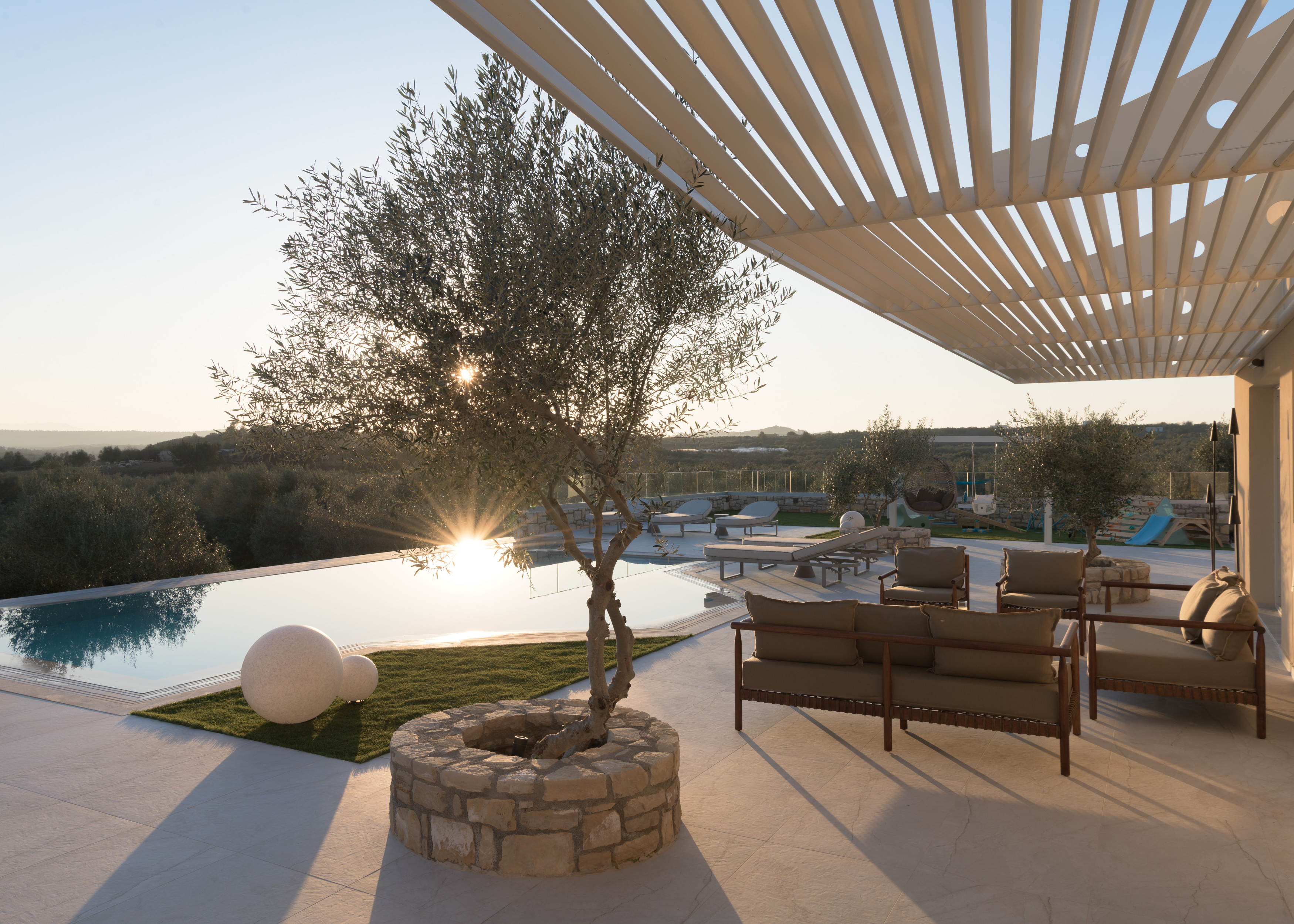 Nestled among whispering olive trees, a sanctuary of serenity.