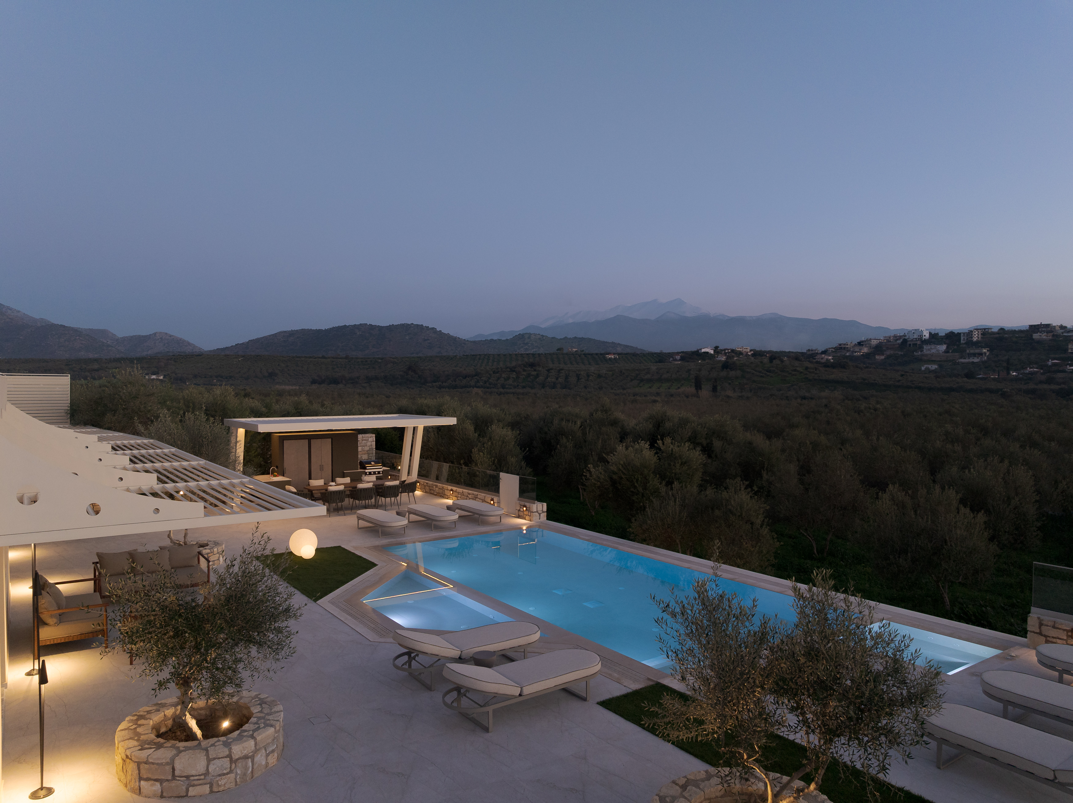 Nestled among whispering olive trees, a sanctuary of serenity.