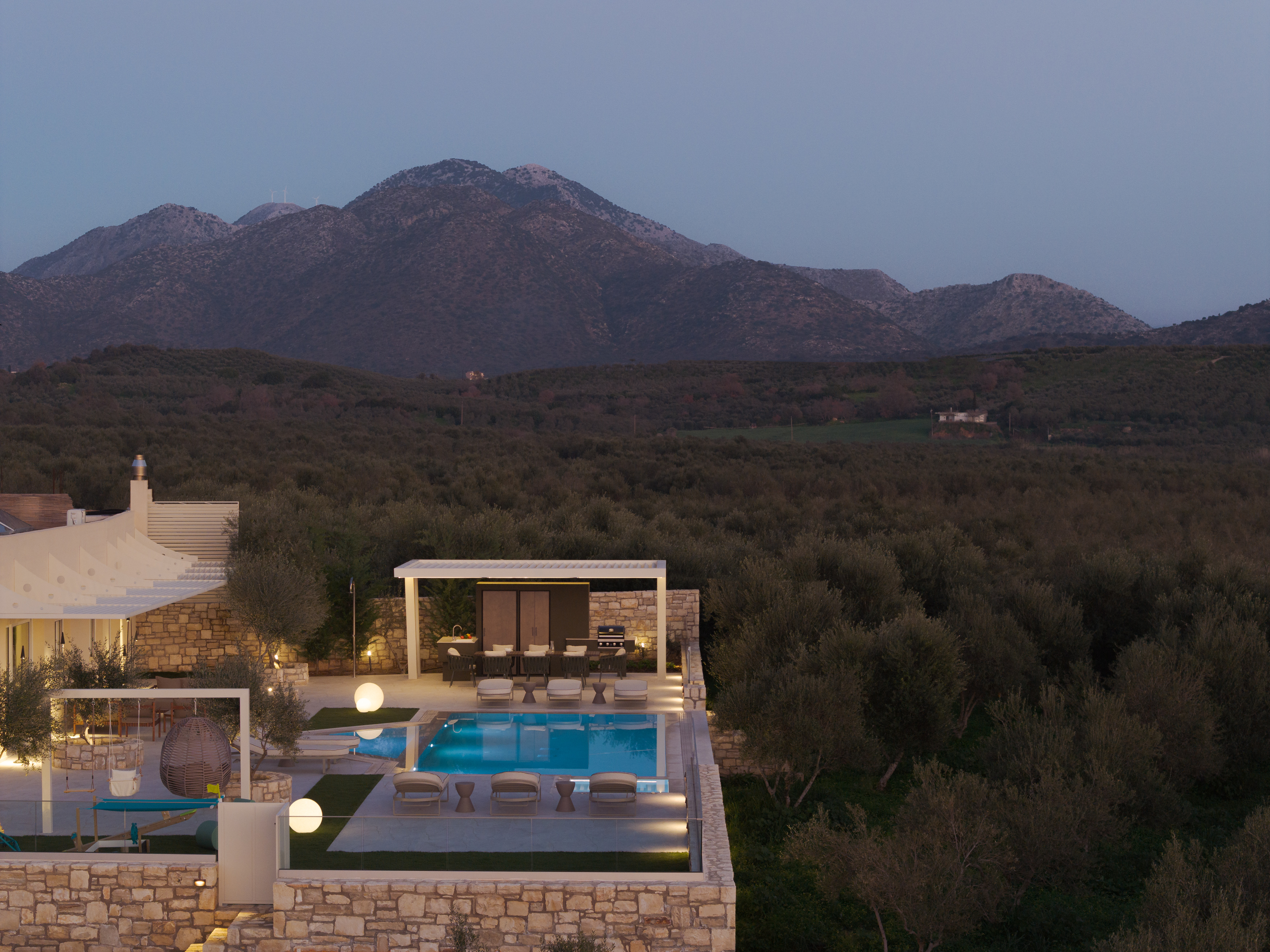 Nestled among whispering olive trees, a sanctuary of serenity.