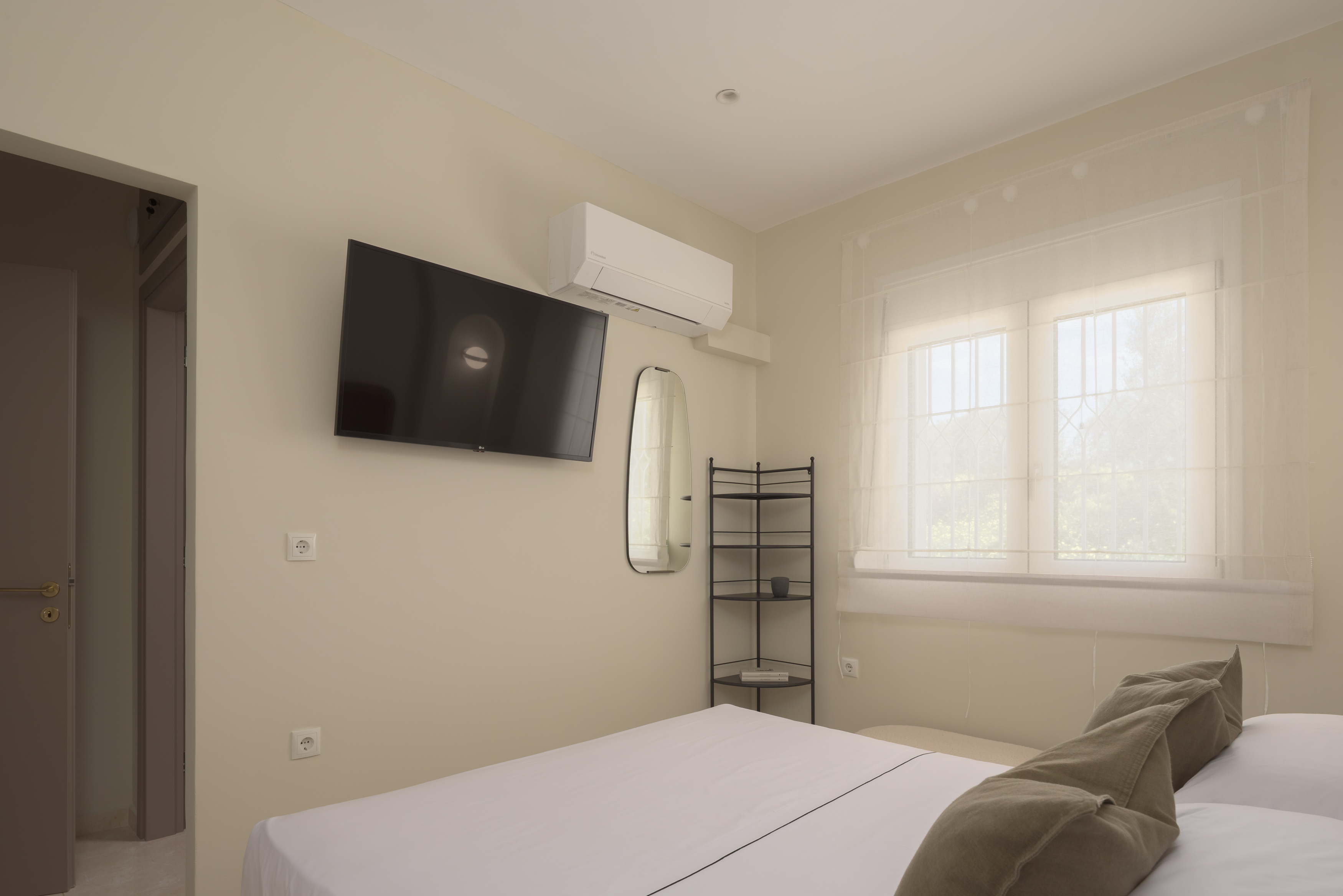 The bedroom also features a 43' Smart TV and a window.