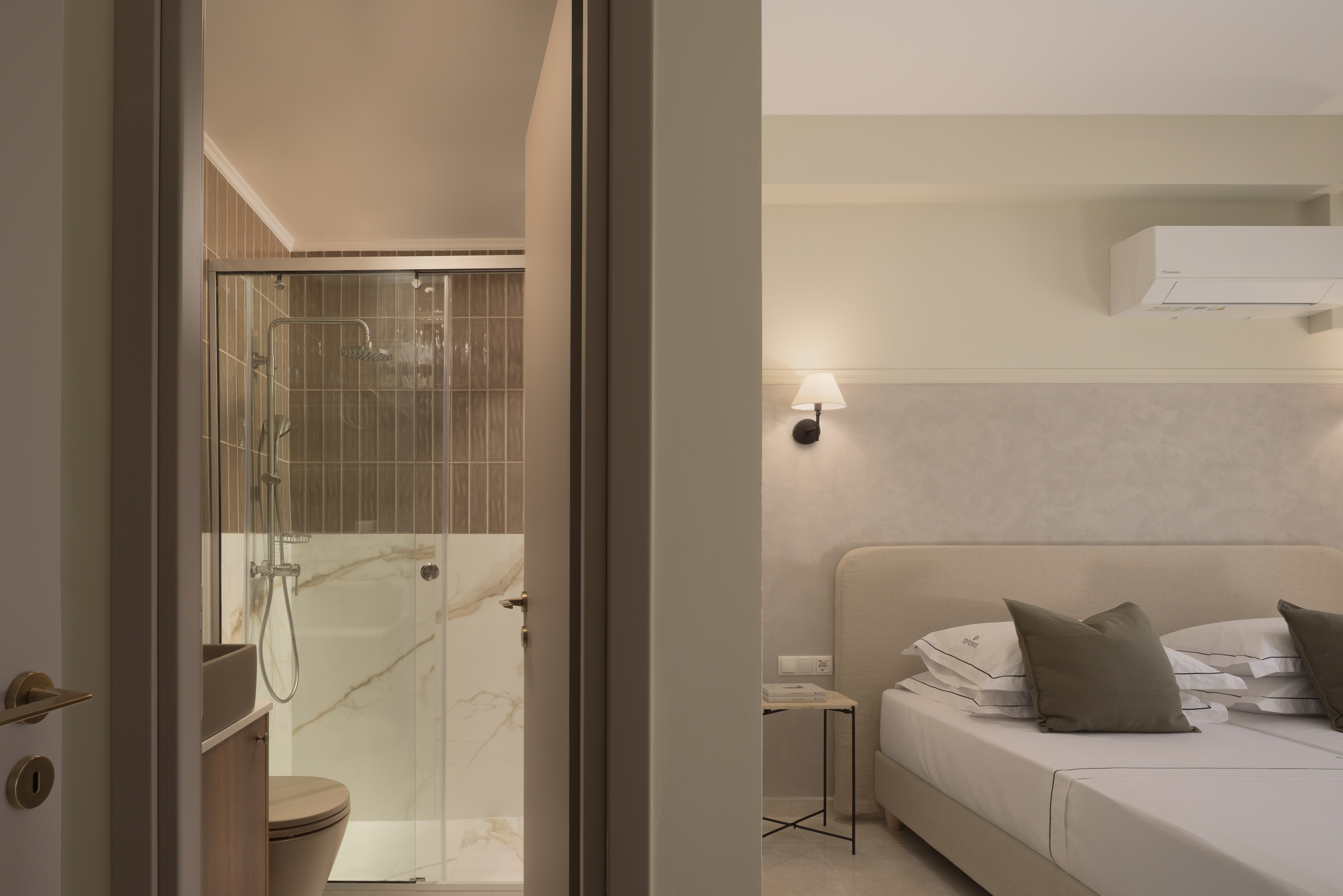 The twin bedroom features a modern en-suite bathroom.