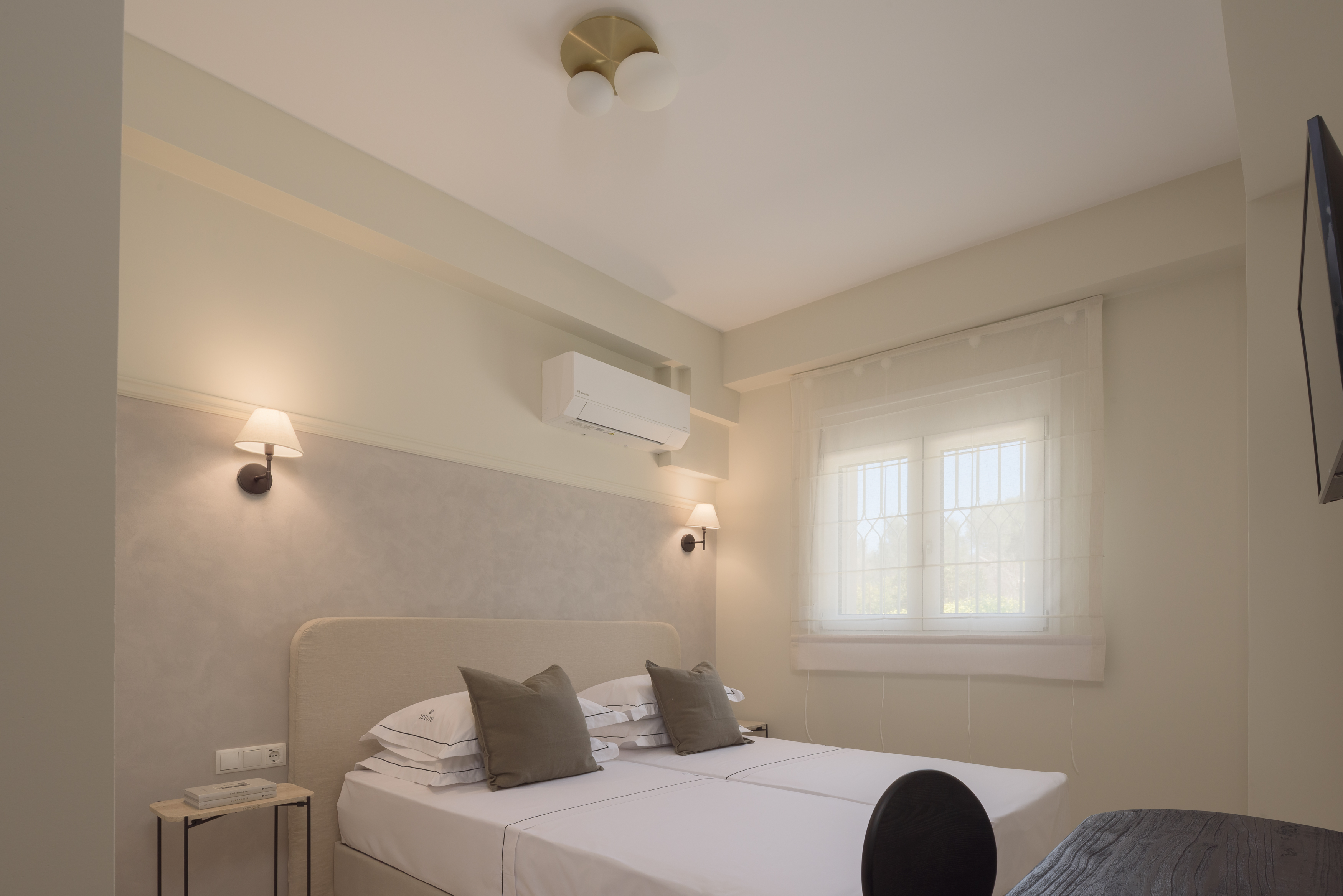 Discover your sanctuary in the beautifully adorned twin bedroom featuring two single beds.