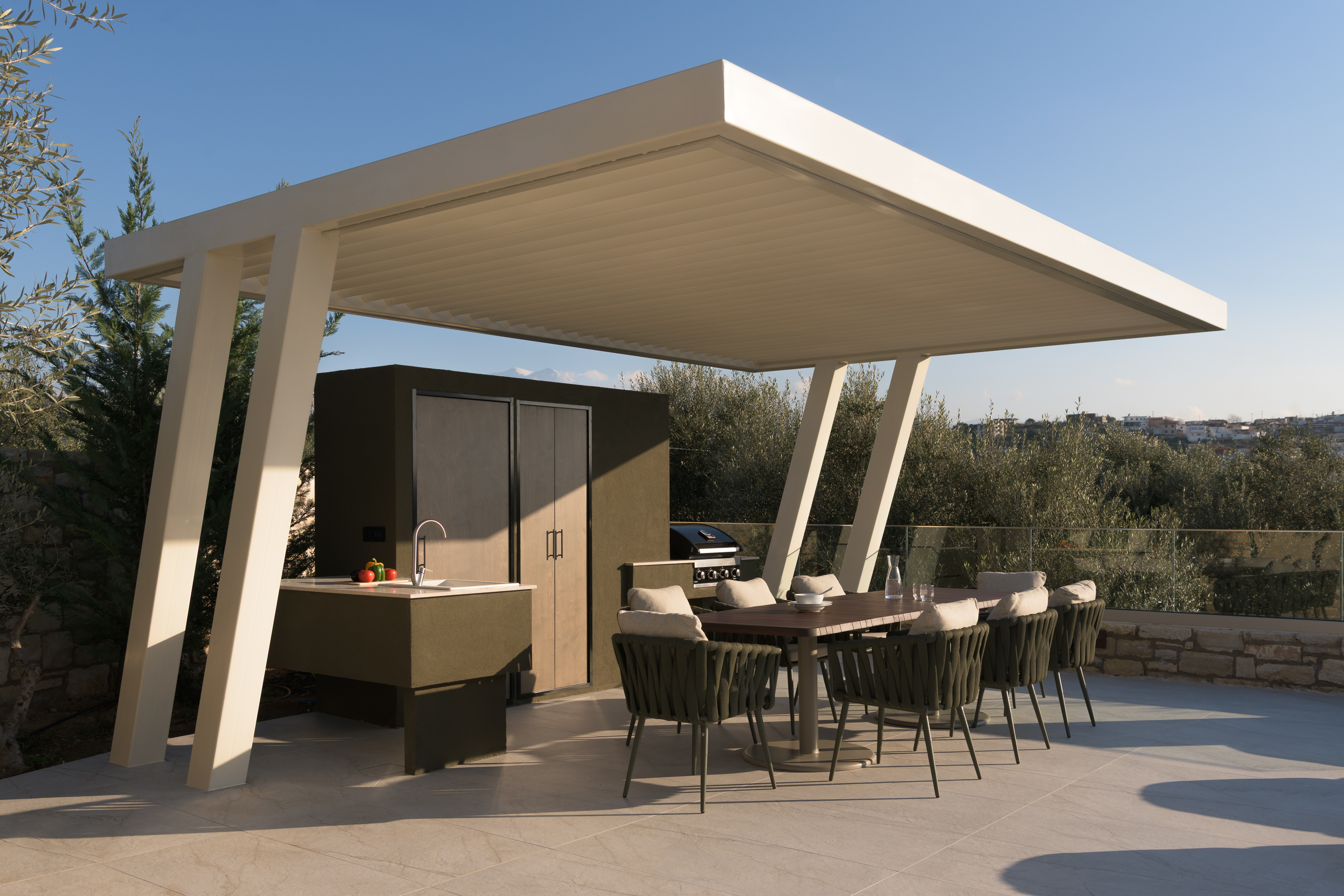 Bespoke outdoor BBQ settings featuring a sink & fridge.